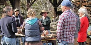 jay debriefing the crew after the wood fire